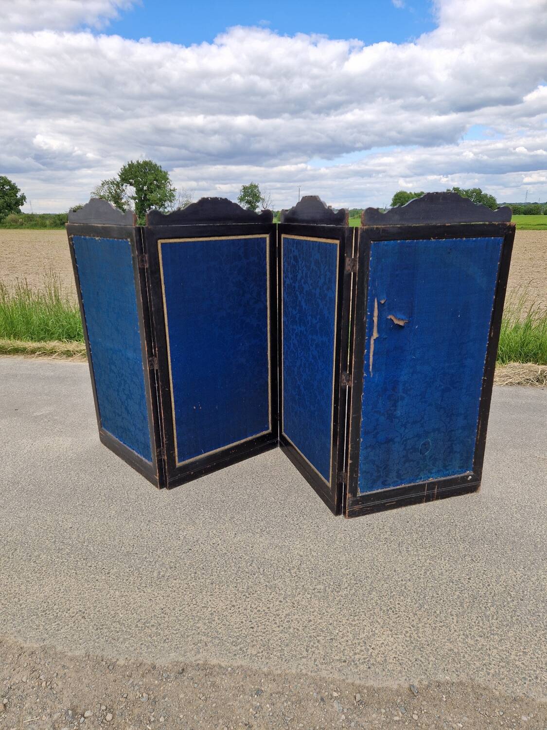 Folding screen in black-painted wood, 19th century