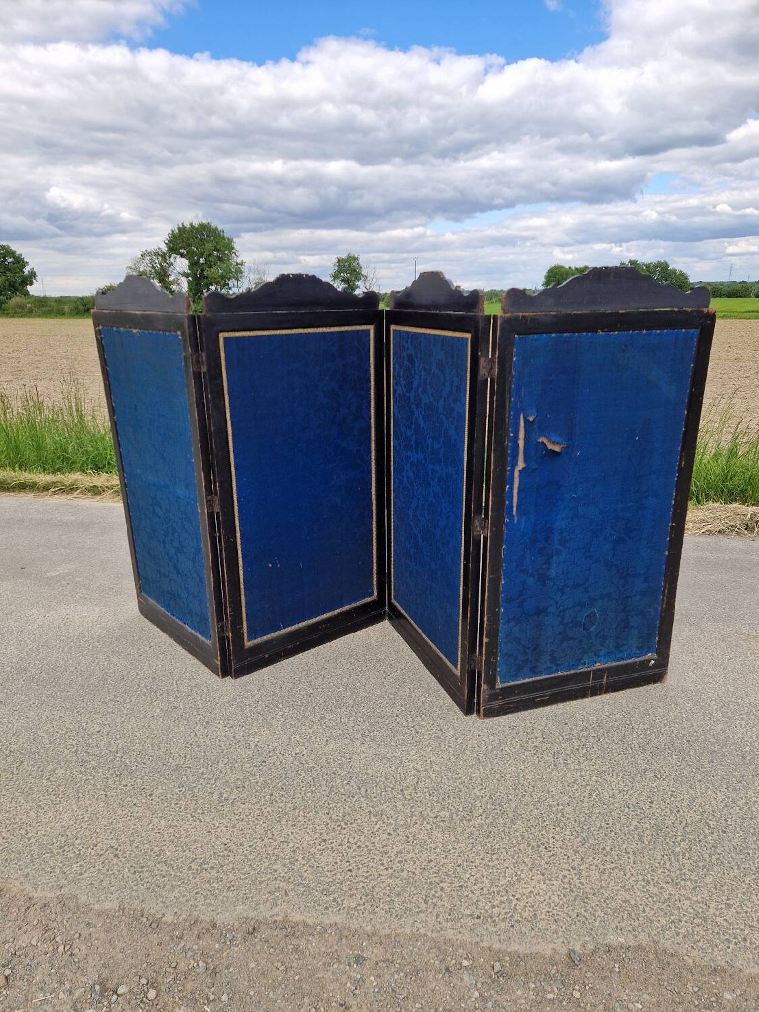 Folding screen in black-painted wood, 19th century
