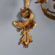 Antique wall sconces in gilded bronze, 20th century, in baroque style.