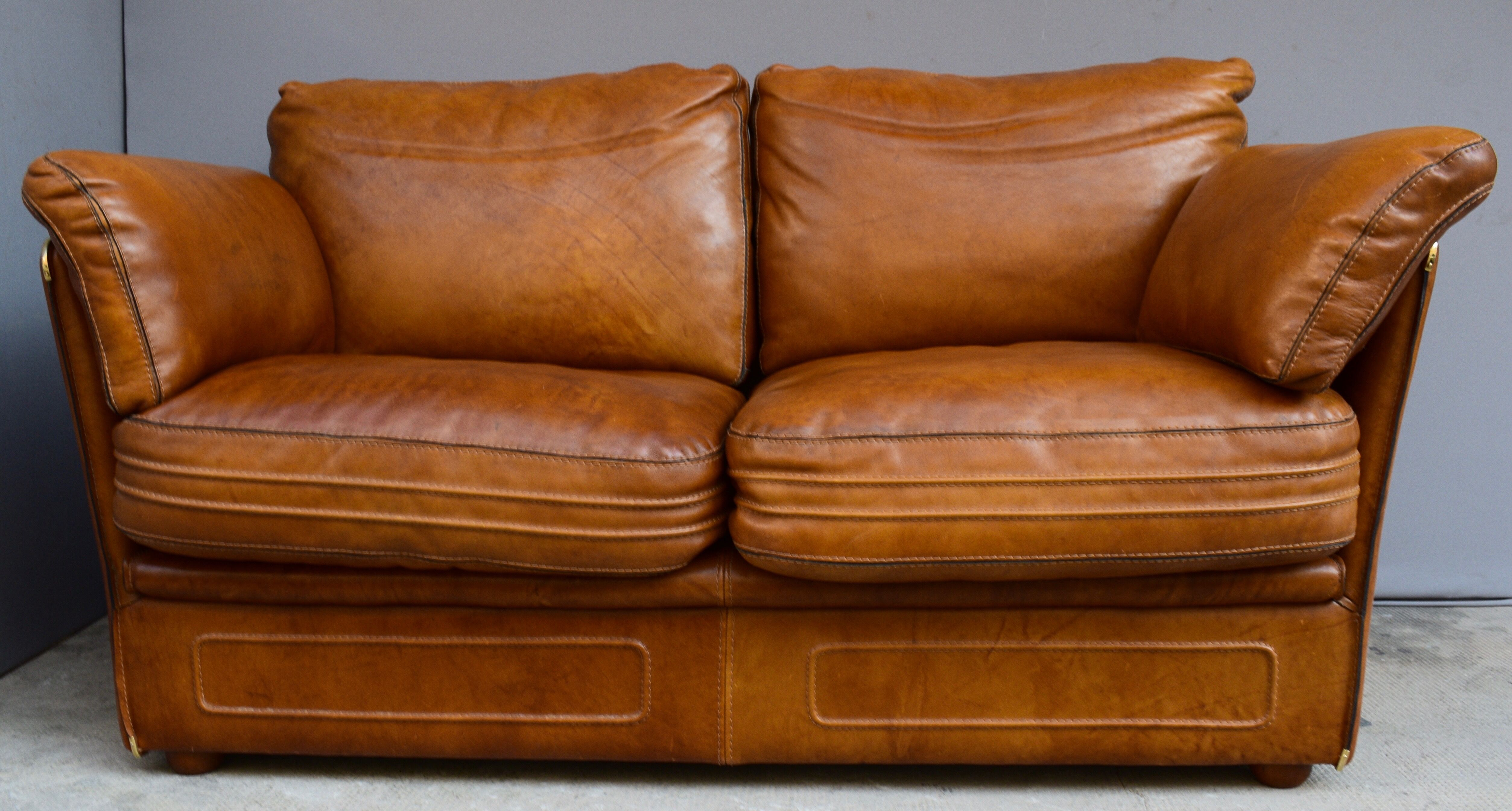 Vintage two-seater leather sofa