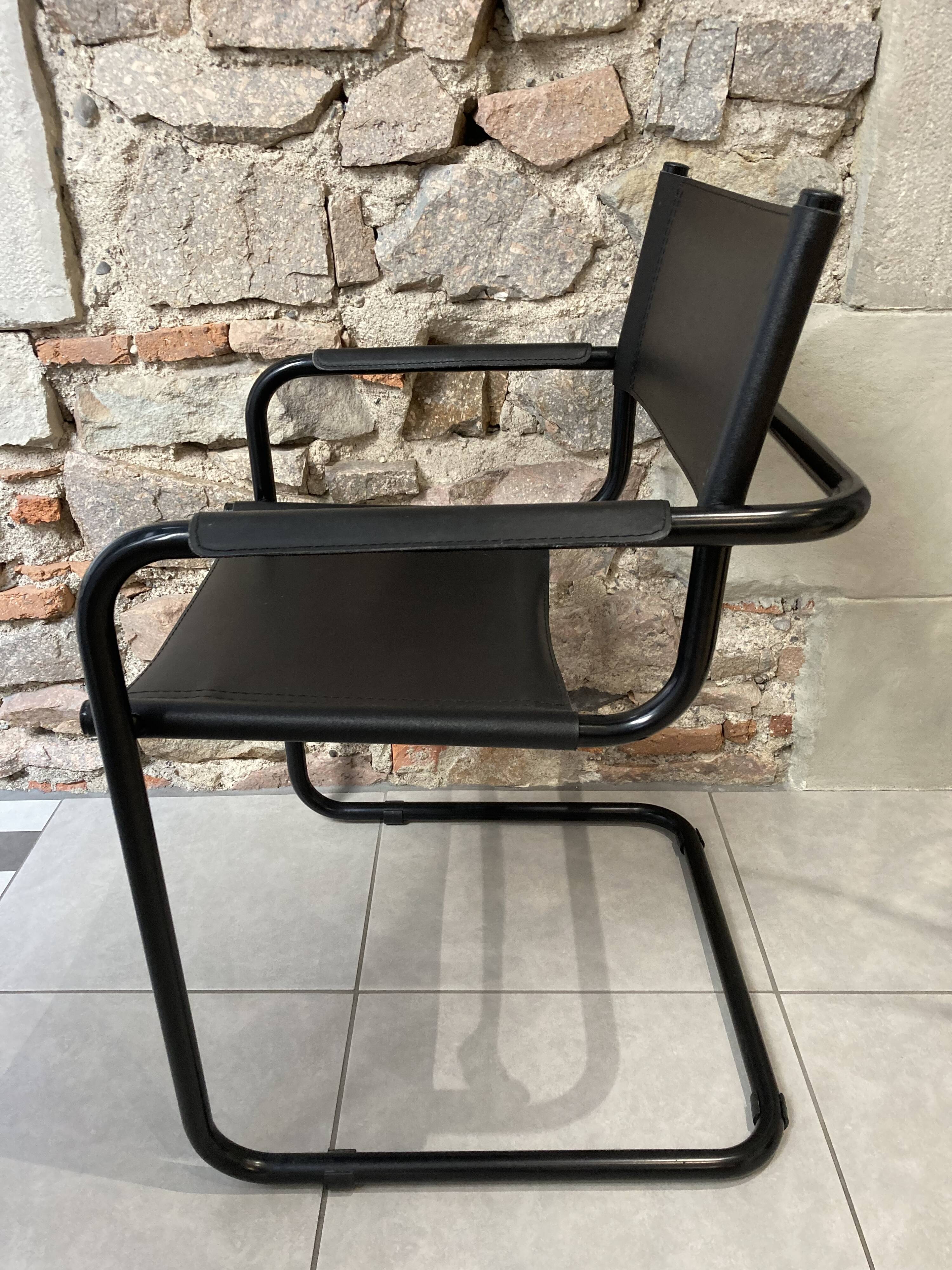 Armchair in black lacquered metal