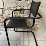 Armchair in black lacquered metal