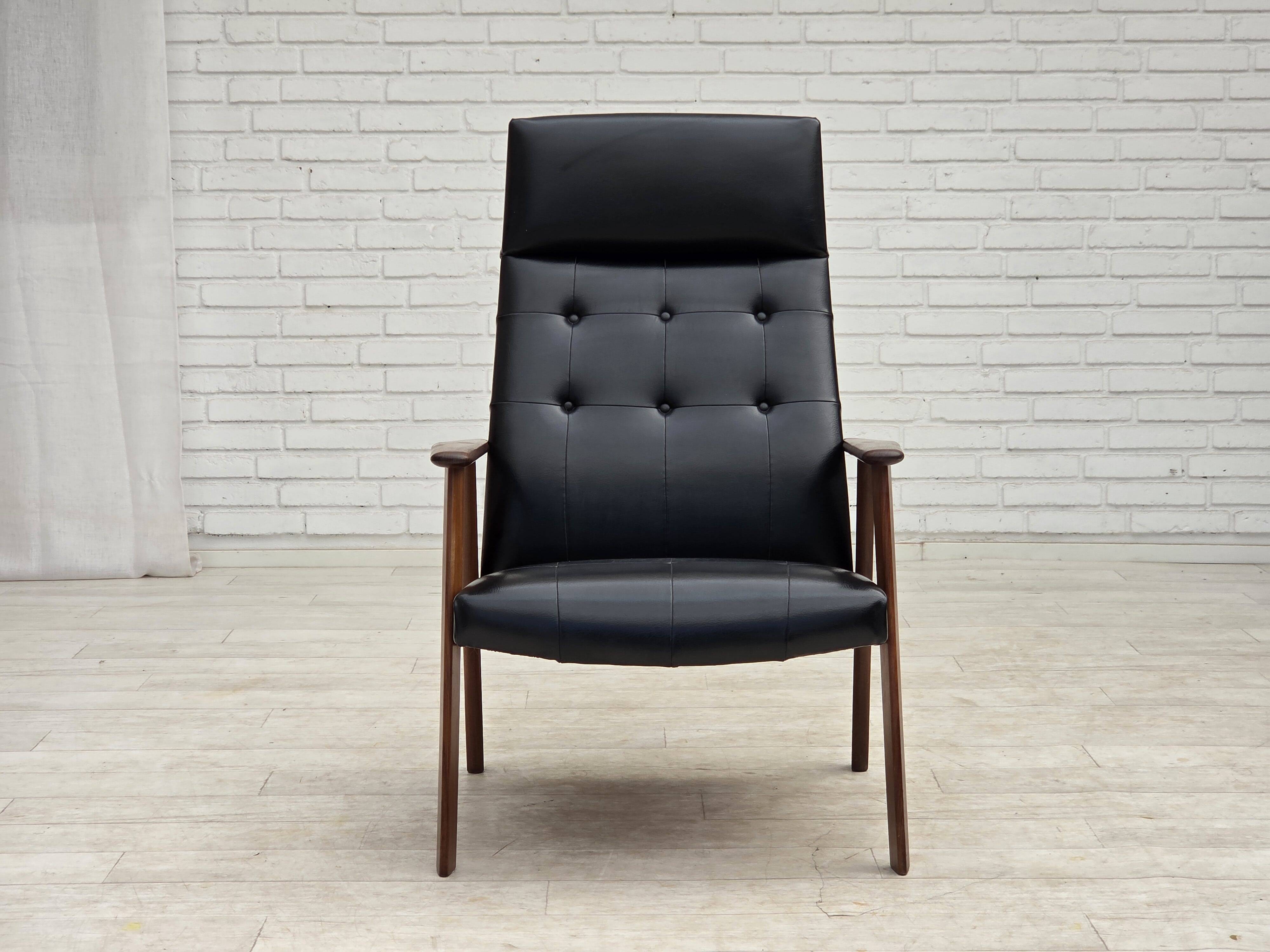 1970s, Danish armchair, black artificial leather, teak wood.