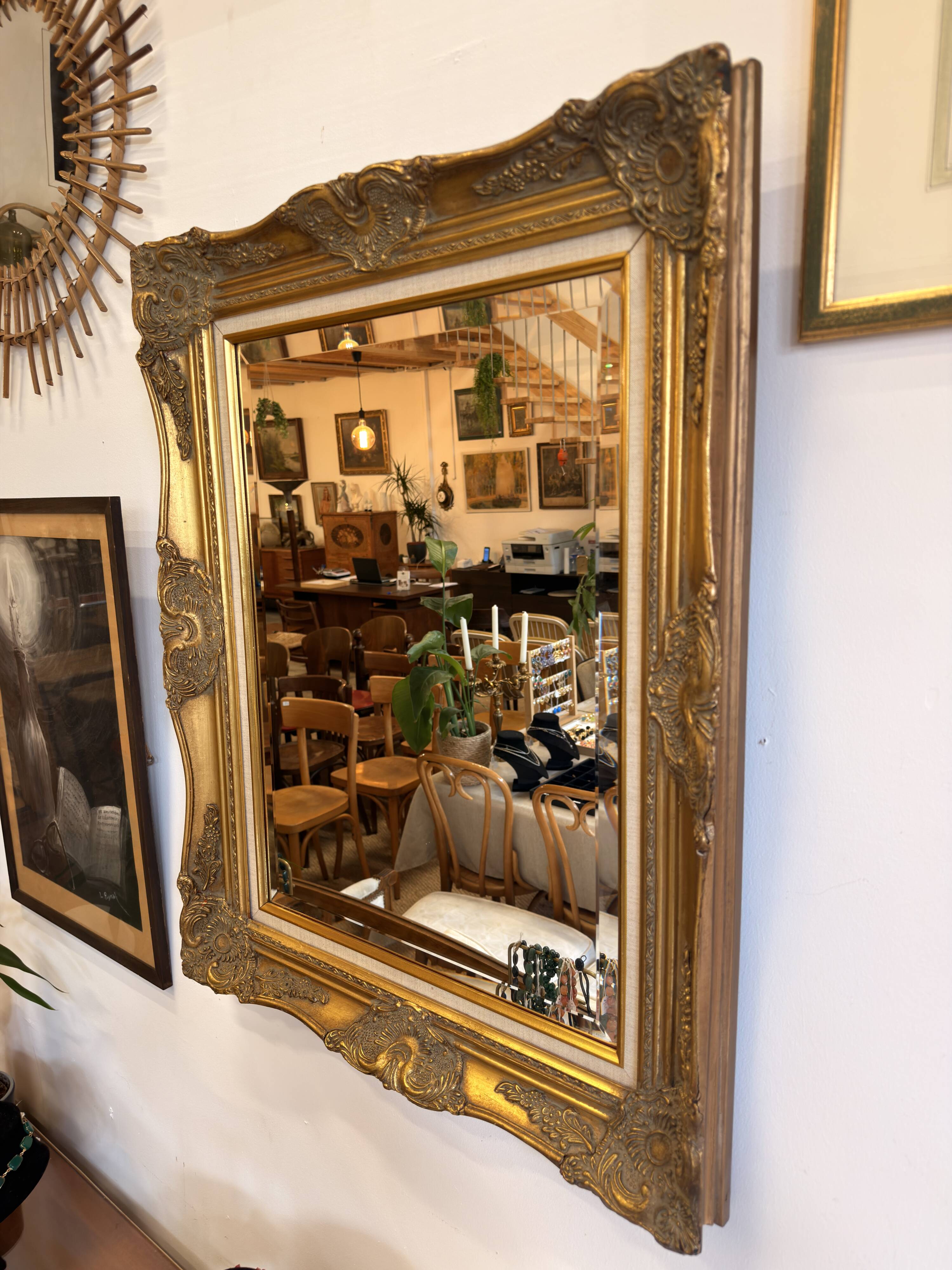 Golden wooden mirror in Louis XV style