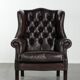Dark brown cowhide Chesterfield wingback armchair in classic English style