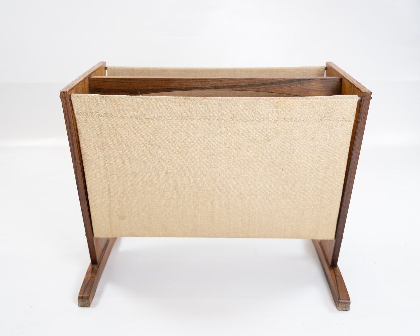 News paper rack in rosewood and canvas of danish design from the 1960s.