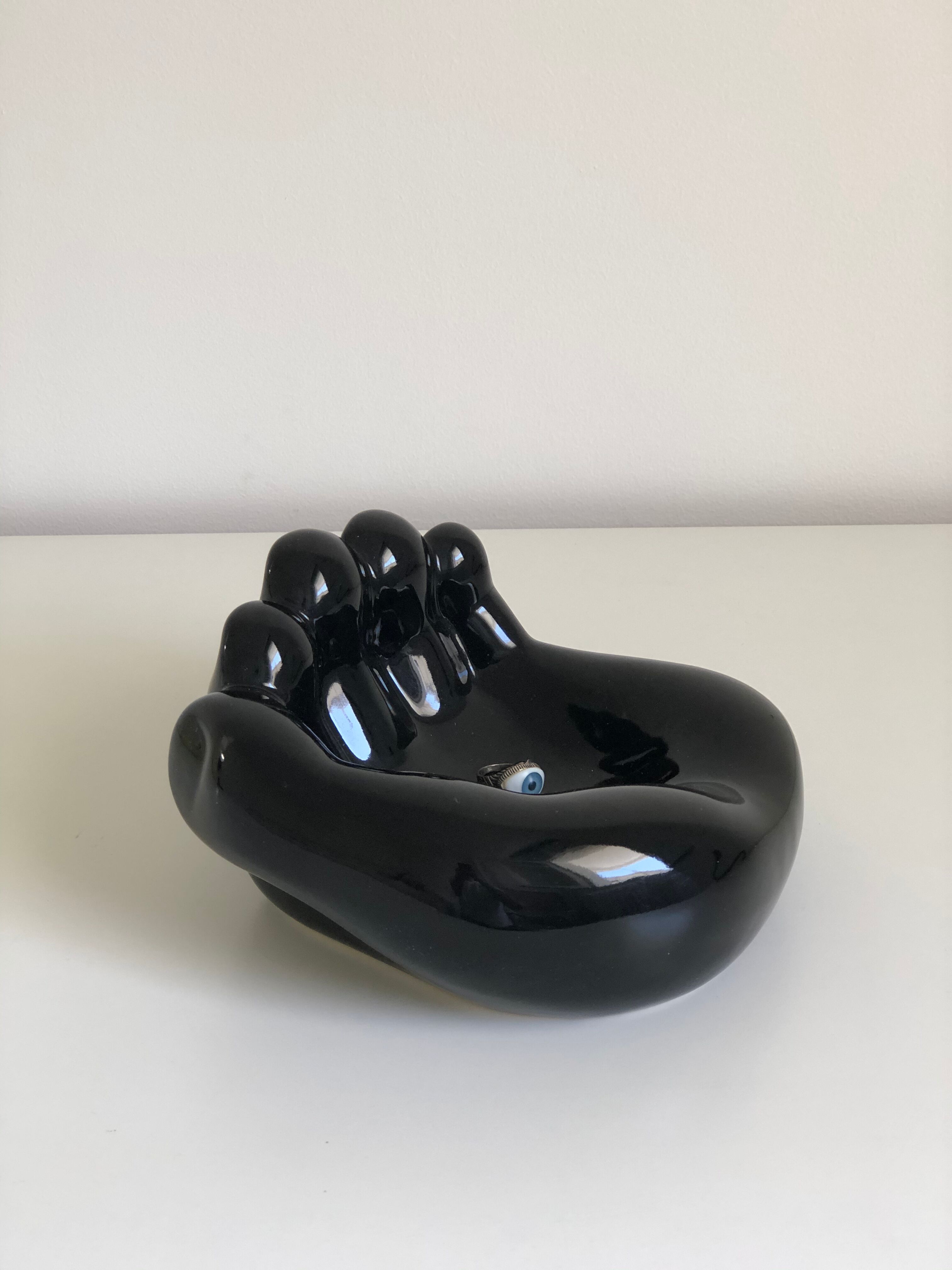 Empty black enamelled hand-shaped ceramic pocket, 1970