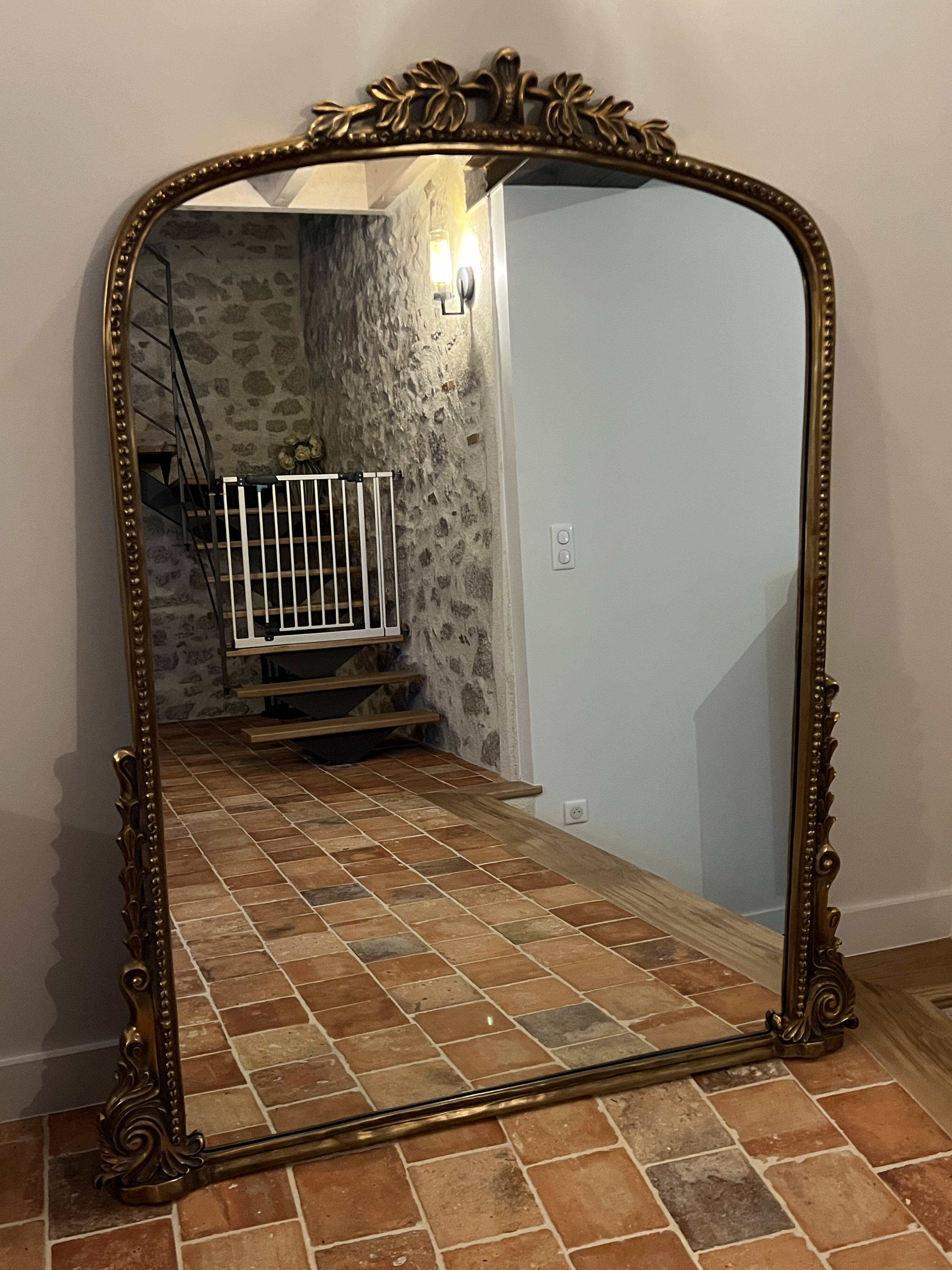 Large gilded mirror with pediment