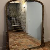 Large gilded mirror with pediment
