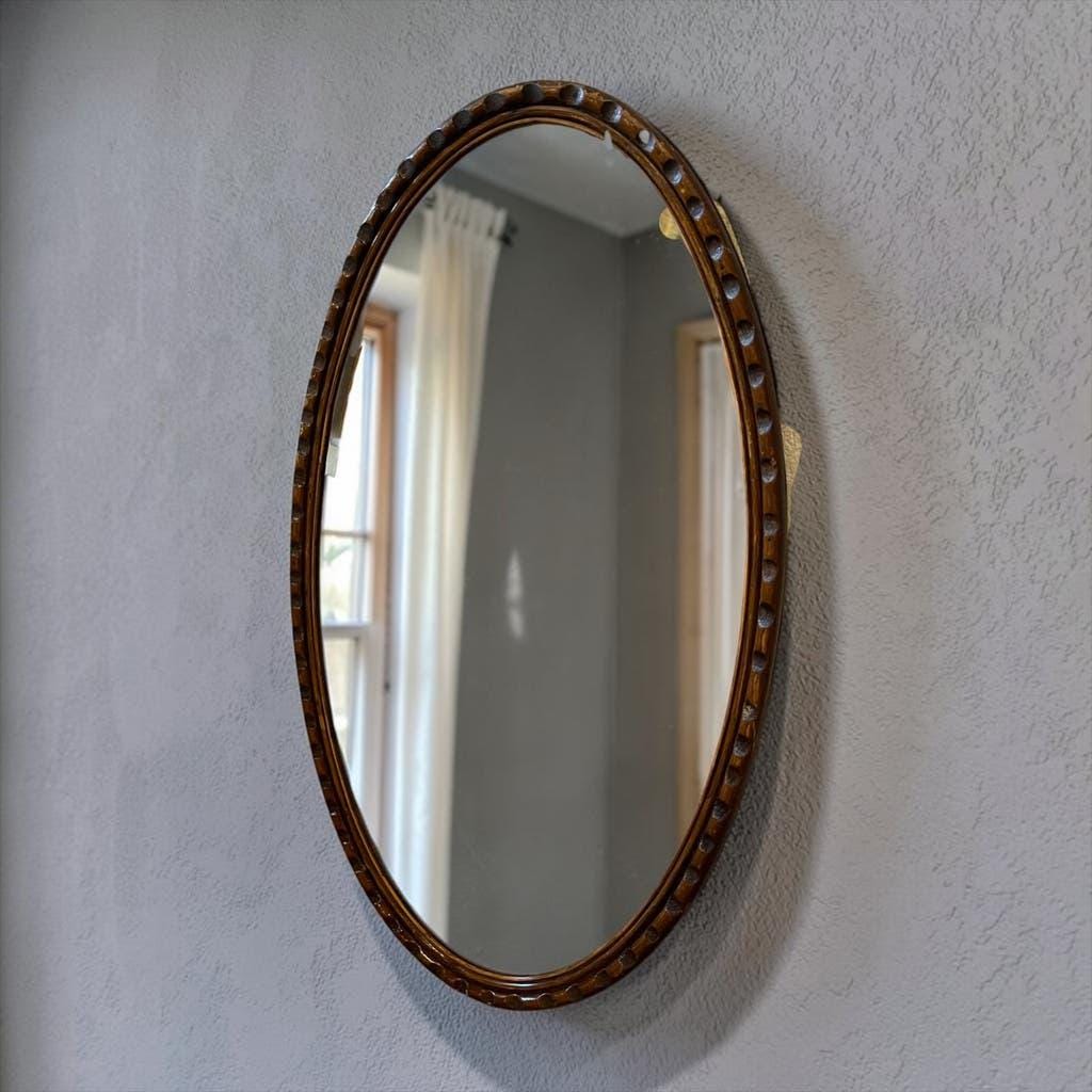 Robust vintage oval wall mirror in wood