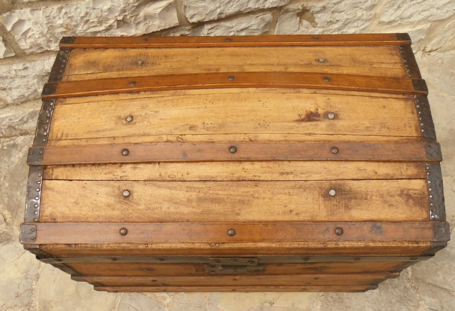 Ancient travel trunk, bulging wooden chest