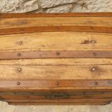 Ancient travel trunk, bulging wooden chest