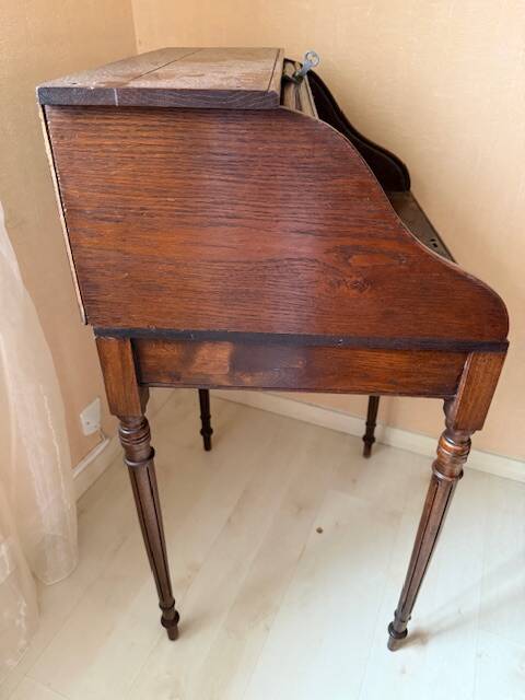 Pretty little secretary with a curtain.