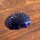 Vintage silver-plated shell butter dish with blue bowl.