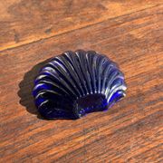 Vintage silver-plated shell butter dish with blue bowl.