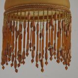 Vintage French amber mottled glass hanging ceiling light with beaded fringe.