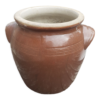 Brown varnished terracotta pot.
