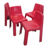 Four red fibreglass chairs from the 1970s.