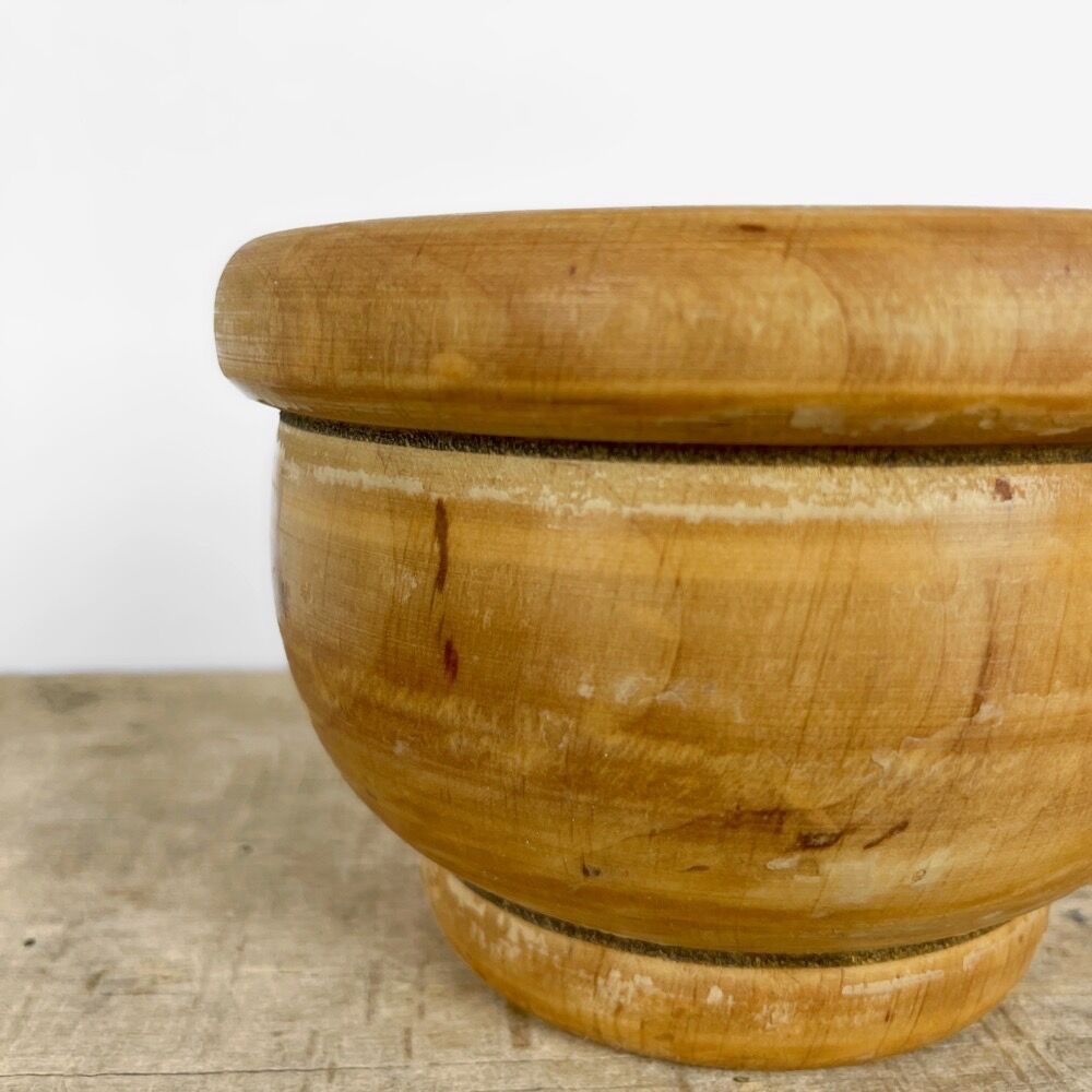 Mortar and old pestle made of olive wood