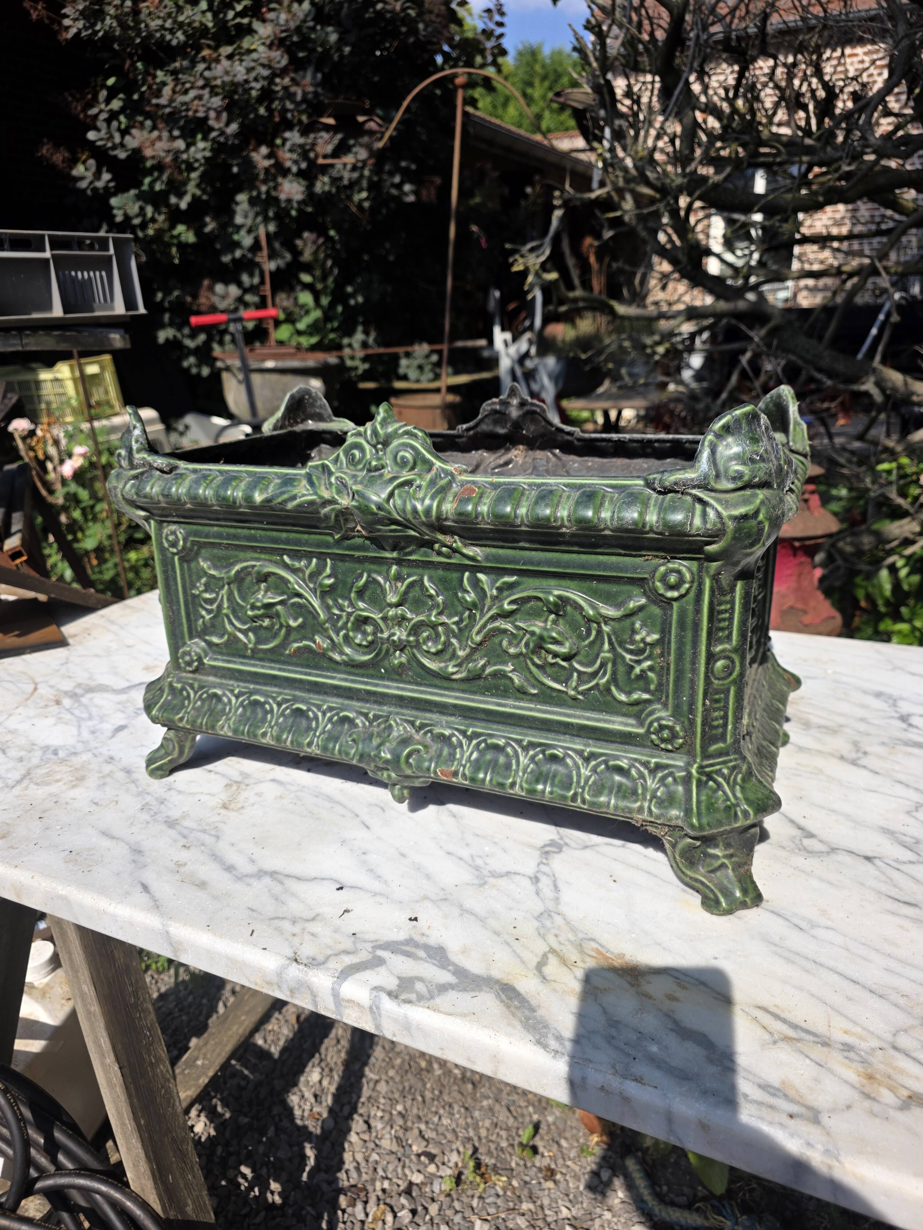 Antique enamelled cast iron planter in the Napoleon III style.