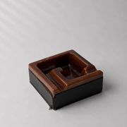 Geometric brown enamelled ashtray with a leather base (1960s-70s)