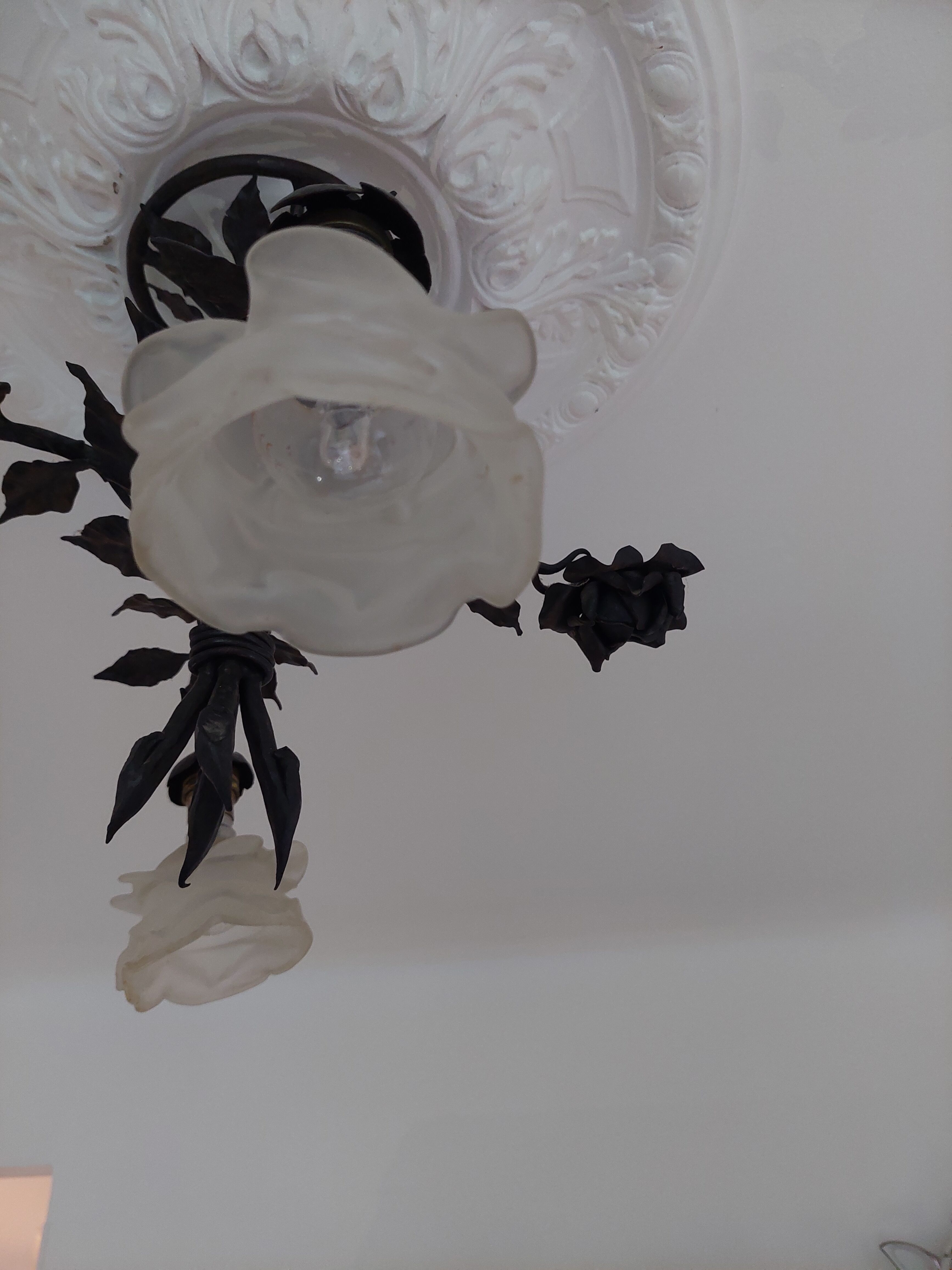 Chandelier with wrought iron and glass rose patterns