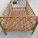 Vintage rattan child or baby bed