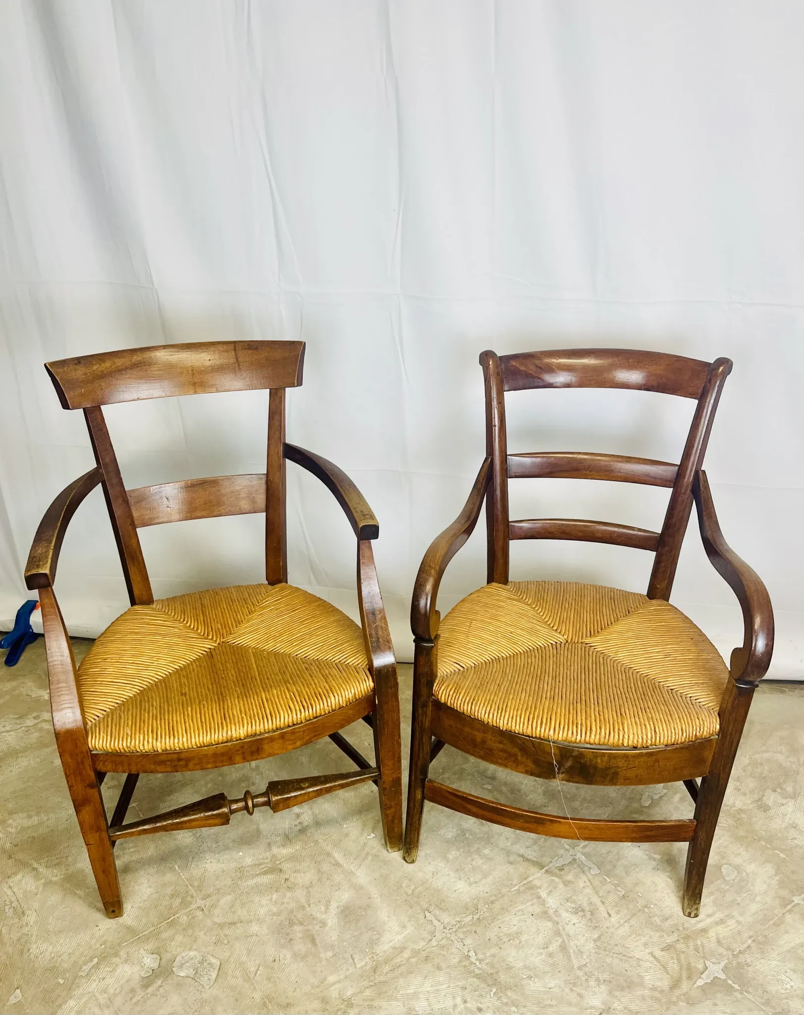 Pair of dissimilar walnut armchairs