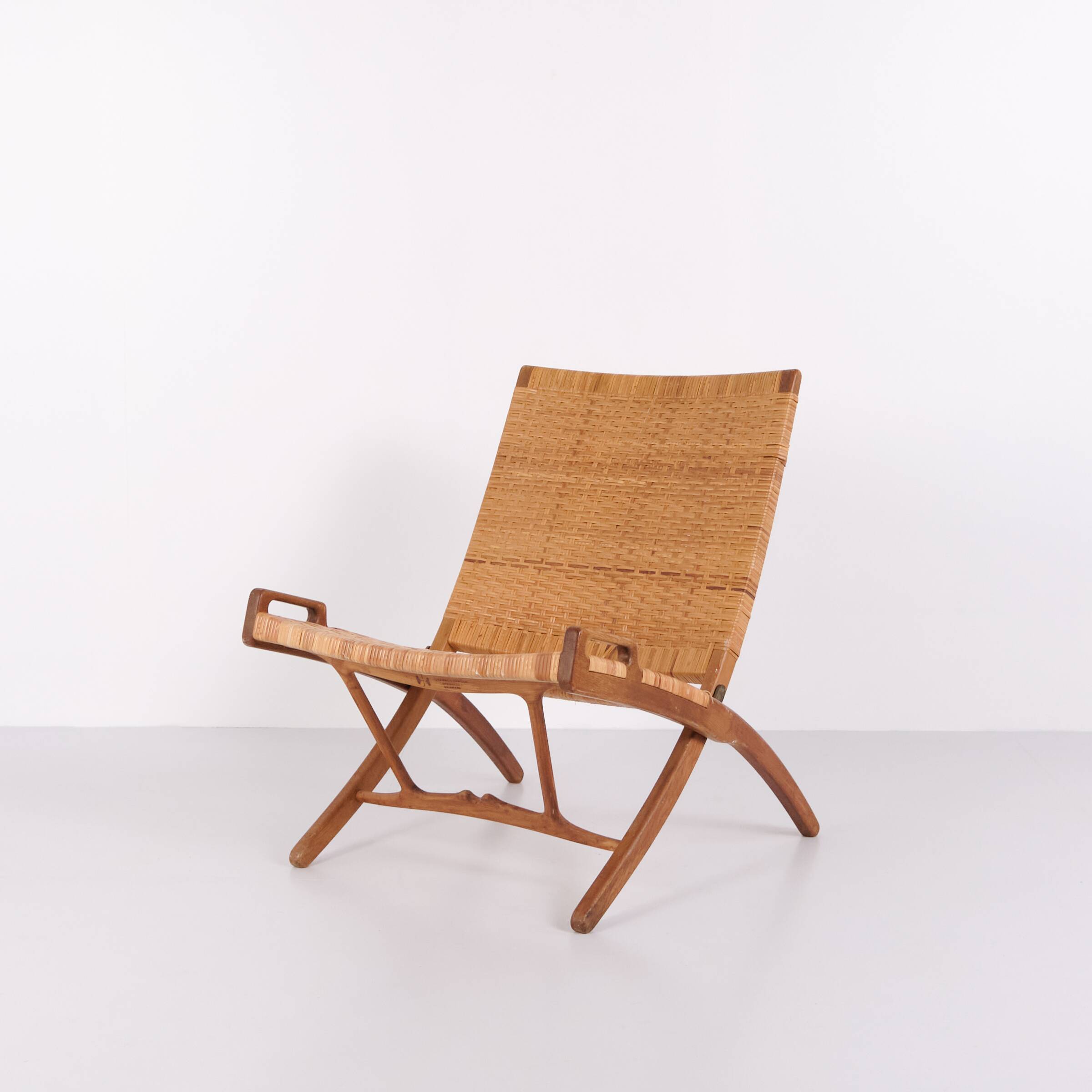 Armchair / folding chair – model JH 512 “The Fireplace Chair” – patinated oak – original cane – Hans J. Wegner – Johannes Hansen – 1950s
