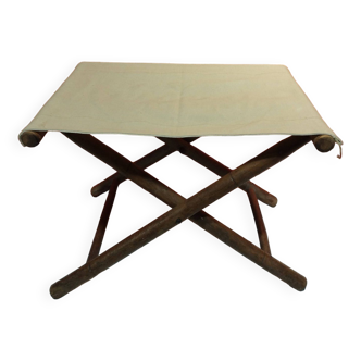 old folding stool in wood and canvas