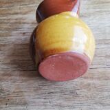Small two-tone brown-yellow terracotta pitcher
