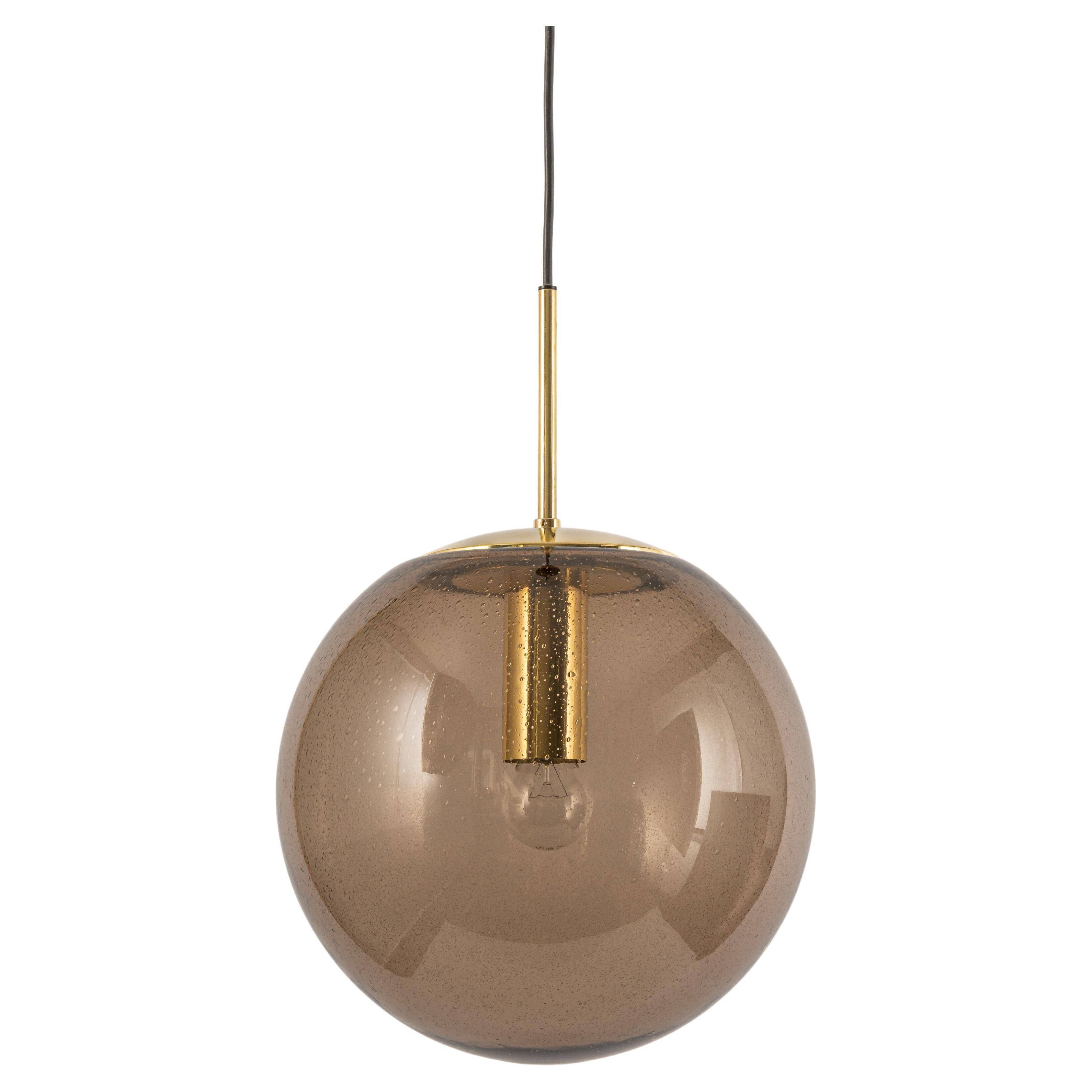 Large smoked glass ball pendant by Limburg in brass, Germany, 1970s.