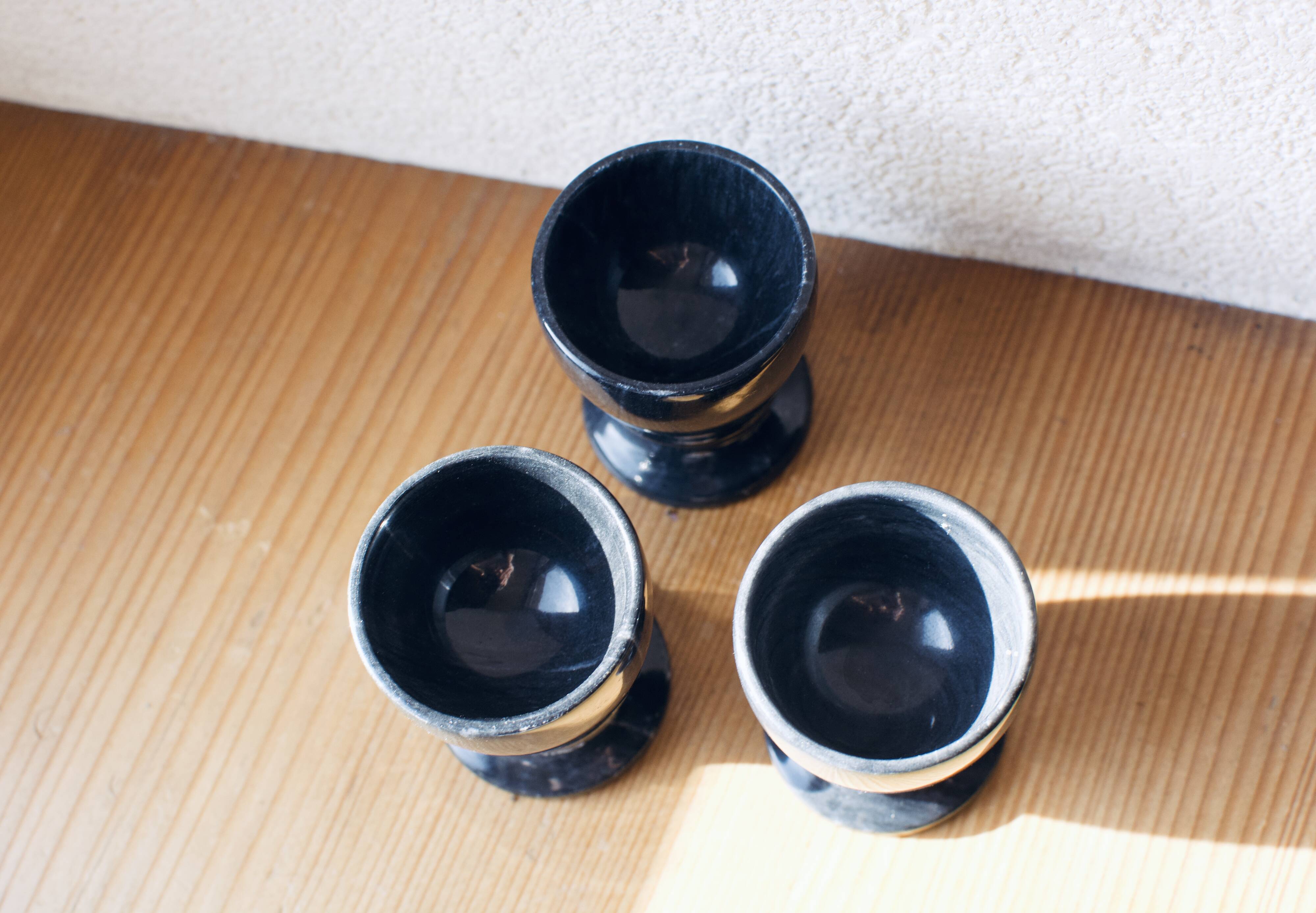 Trio of black marble cockroaches
