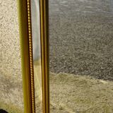 Hall mirror, gilded frame with fillets and fleur-de-lis.