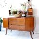 Vintage 1950s brown wooden dressing table with a double mirror and integrated storage.