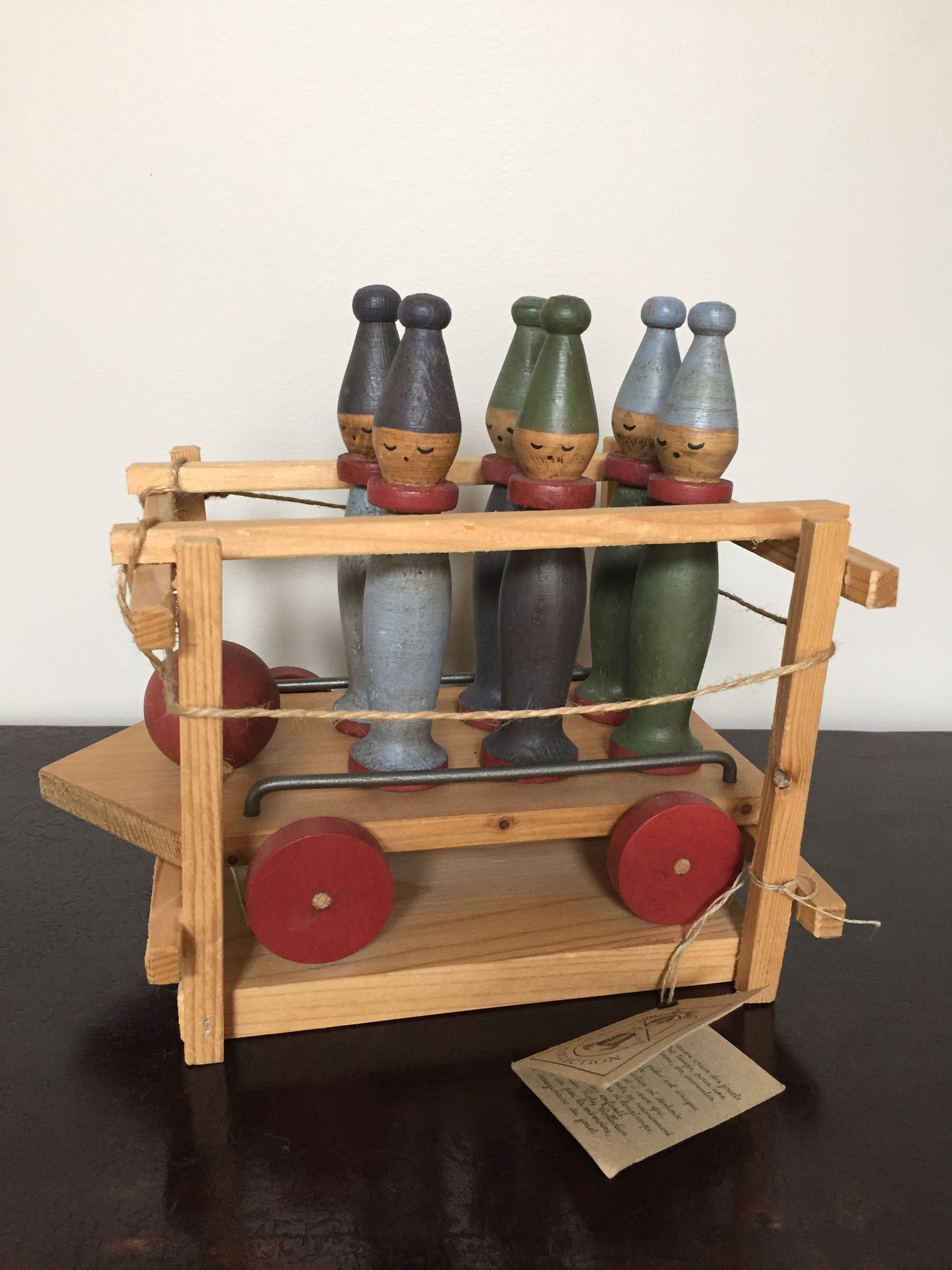 Set of Moulin Roty brand wooden bowling on roller cart, limited series.