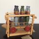 Set of Moulin Roty brand wooden bowling on roller cart, limited series.