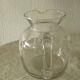 Glassware, including a jug and engraved crystal carafe.