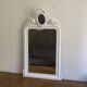 Mirror from the late 19th century with a decorated pediment. 112x66.
