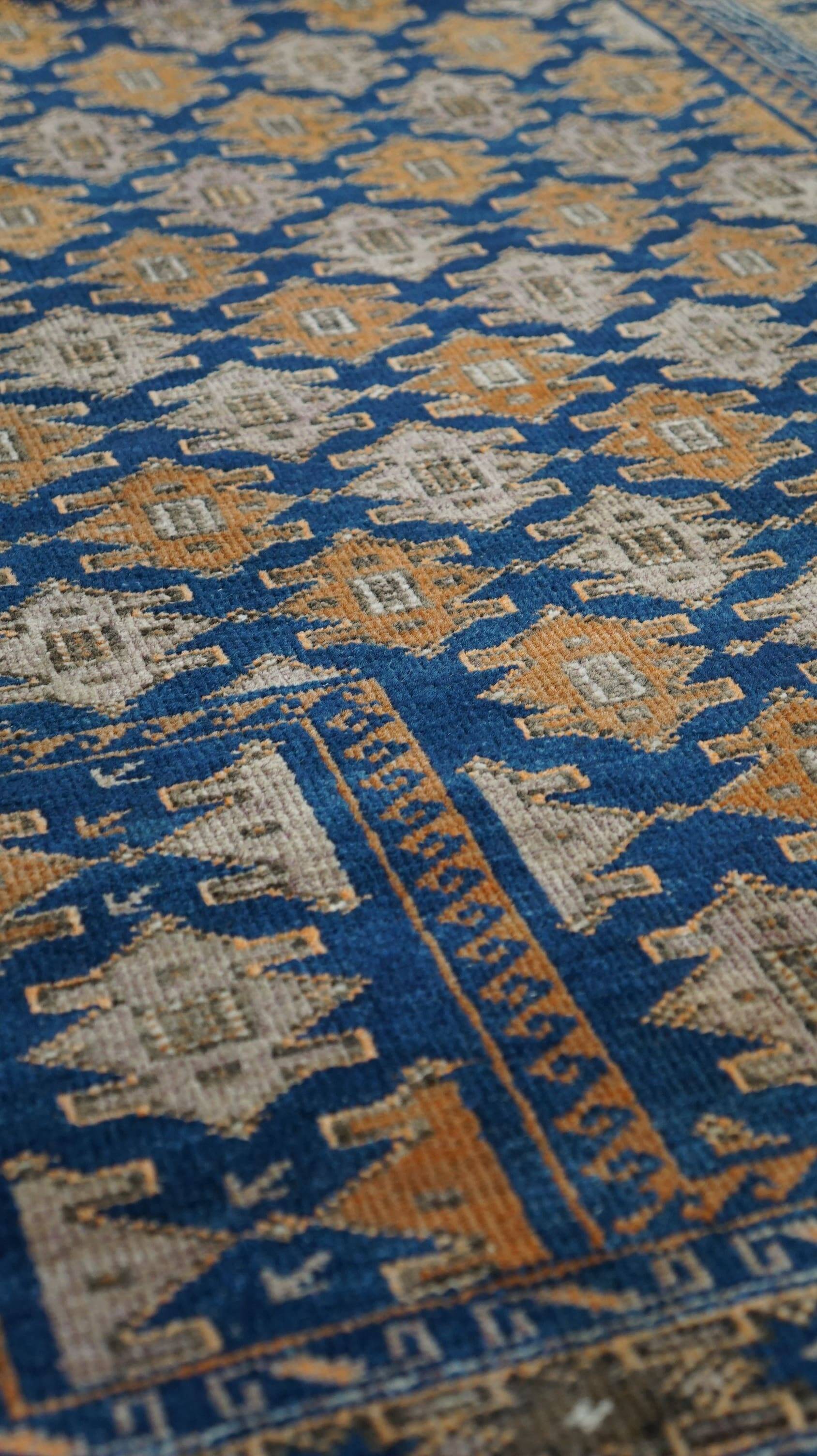 Orange and blue Persian rug 132×83 cm