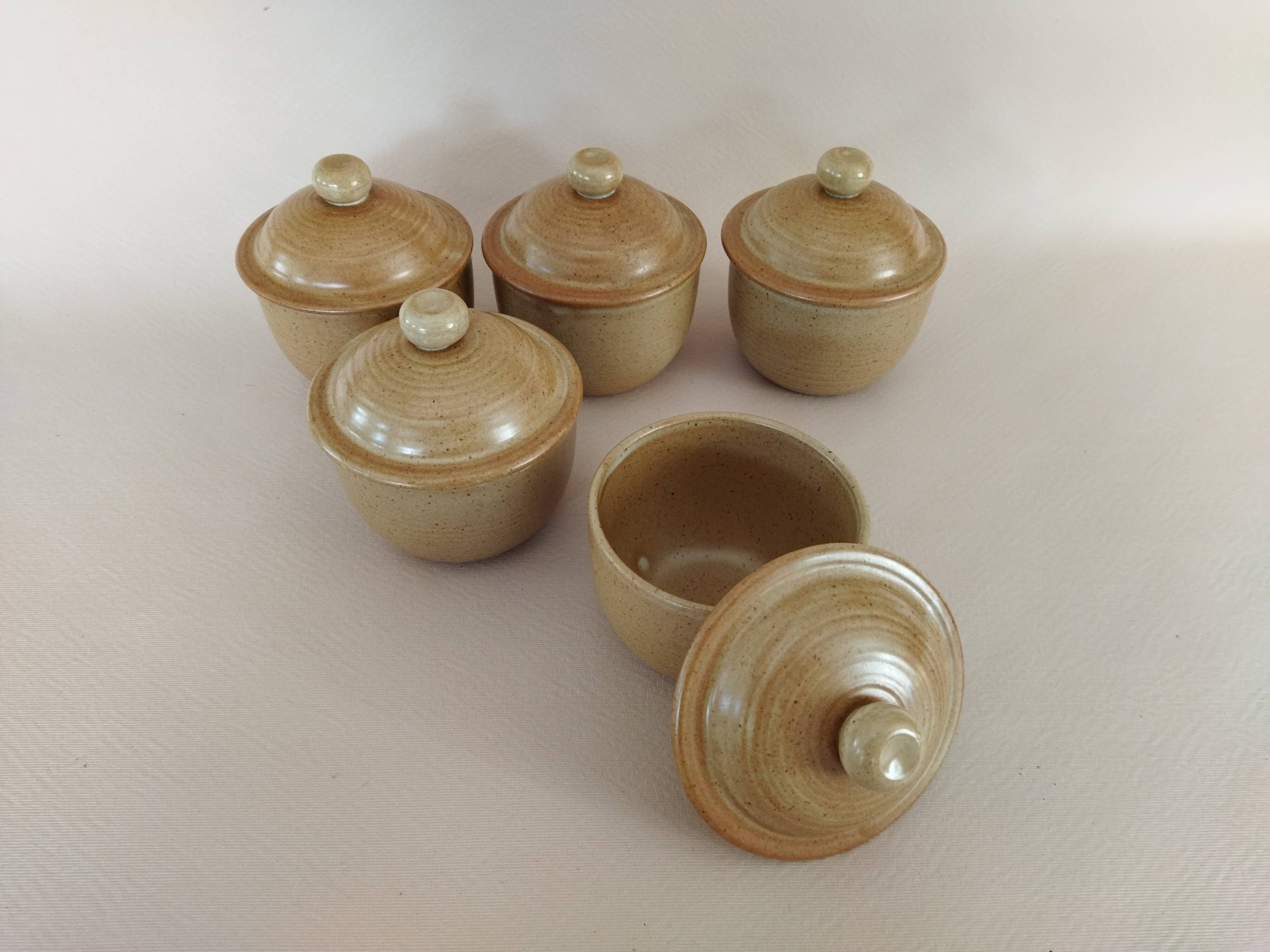 Covered tea bowls in CNP Village sandstone