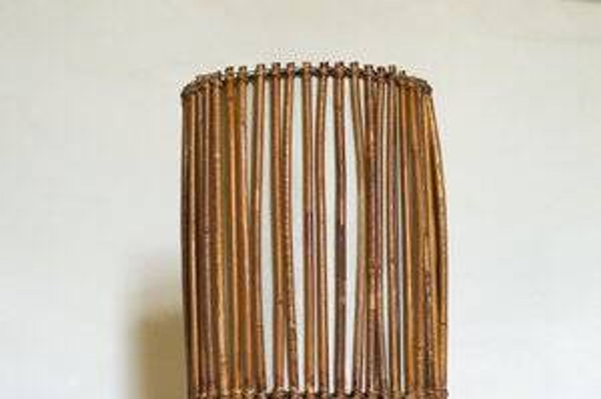 Mid-century rattan floor lamp, in the style of Louis Sognot.