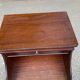 Mahogany bedside table in English style with stool.
