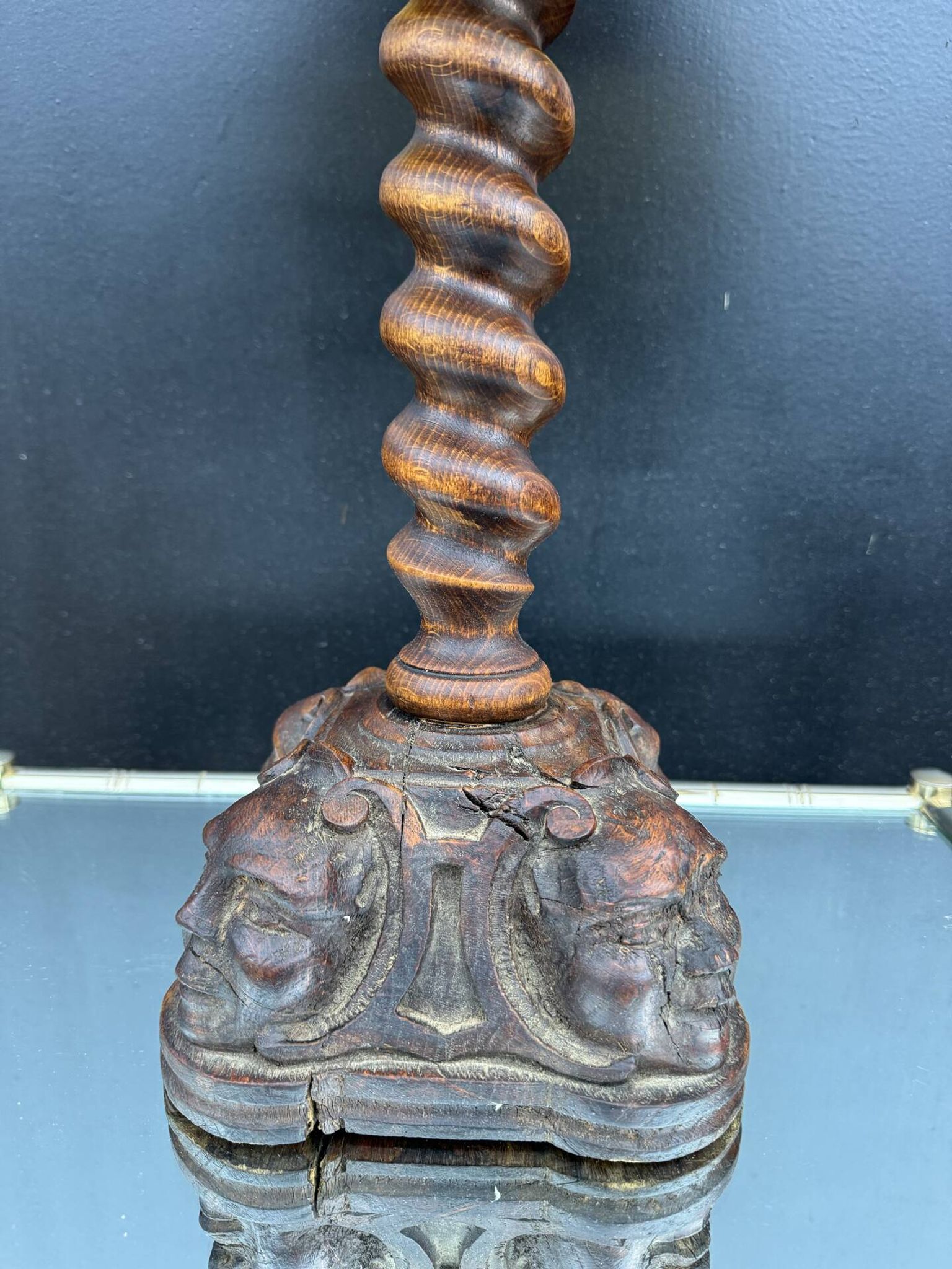 Sculpted wooden lamp with faces, antique.