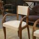 Pair of bridge armchairs in walnut and cream boucle fabric, early 20th century.
