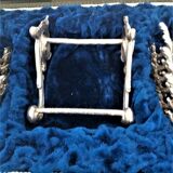 Twelve knife holders with ladle doors.