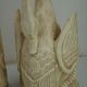 Deux ornements d'applique en bois sculpté et laqué crème,  représentant des cygnes