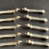 10 anciens porte-couteaux métal argenté zoomorphe (chien Teckel)