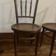 Pair of antique caned bistro chairs stamped Fischel