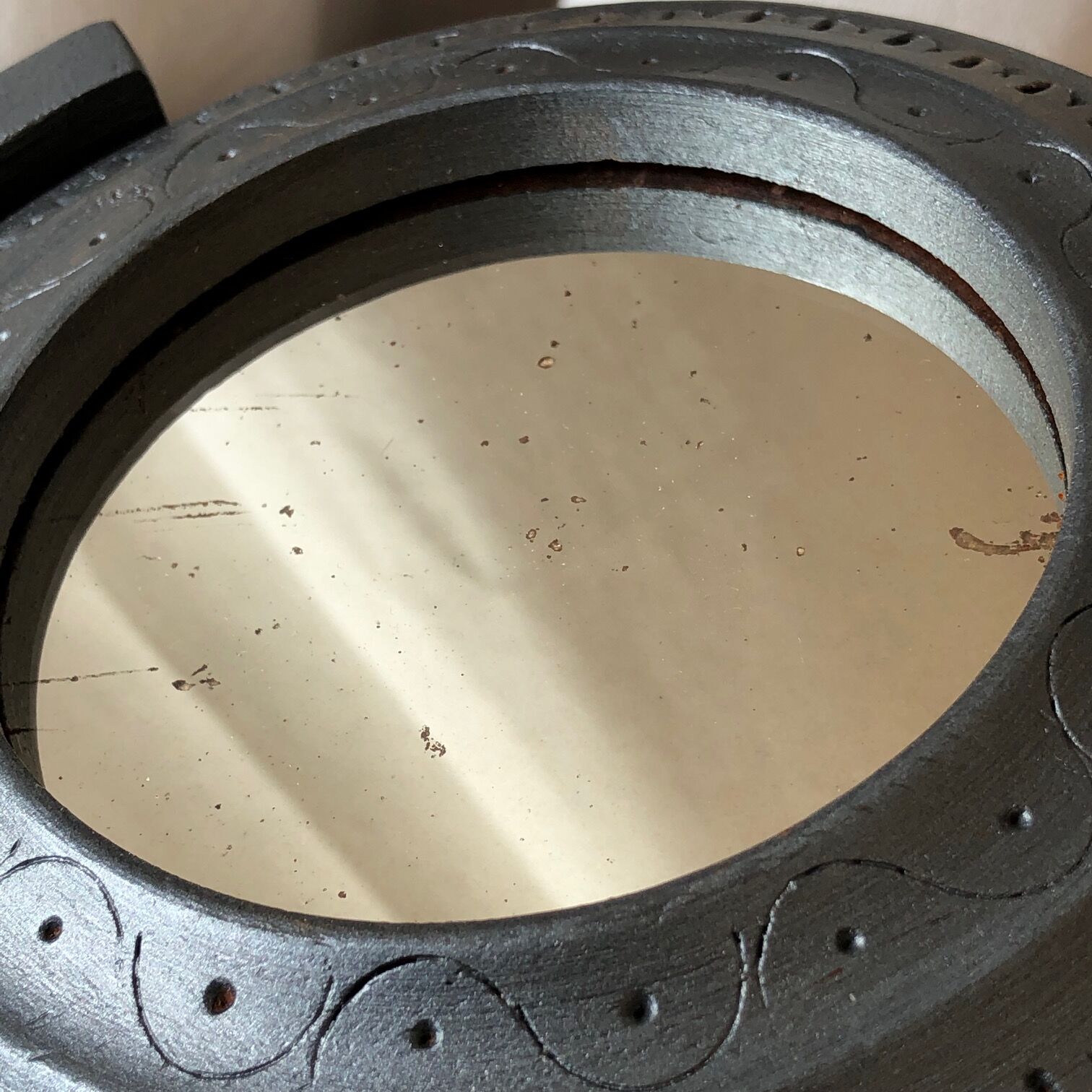 Wooden mirror on foot